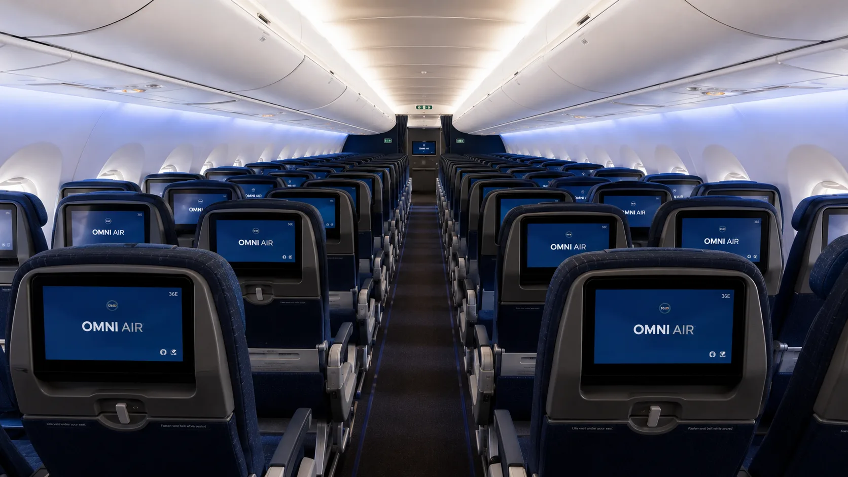 Omni Air Economy cabin, seatback screens down the aisle